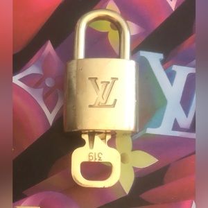 Louis Vuitton. Lock and Key. Brass